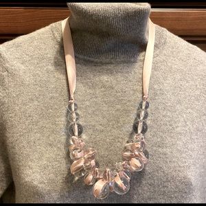 Statement necklace with clear beads and pink satin ribbon